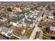 A diverse collection of homes in a bustling neighborhood viewed from above, tree-lined streets at 1811 Livery Way, Indianapolis, IN 46202