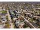 An aerial view of a vibrant neighborhood filled with homes and blossoming trees on a clear day at 1811 Livery Way, Indianapolis, IN 46202