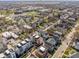 An aerial view showcases modern townhomes nestled in a vibrant neighborhood at 1811 Livery Way, Indianapolis, IN 46202
