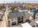 Urban living captured in an aerial view of homes with the cityscape in the background at 1811 Livery Way, Indianapolis, IN 46202
