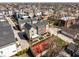 An aerial perspective of townhomes nestled in a neighborhood, surrounded by mature trees at 1811 Livery Way, Indianapolis, IN 46202