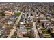 Bird's-eye view of a neighborhood with tree-lined streets and diverse architecture on a sunny day at 1811 Livery Way, Indianapolis, IN 46202