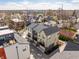 A neighborhood showcasing a blend of modern and traditional homes, lush trees and clear blue sky at 1811 Livery Way, Indianapolis, IN 46202