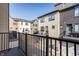 A view from the balcony overlooking neighboring townhomes, garages and colorful recycling bins at 1811 Livery Way, Indianapolis, IN 46202