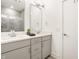 Modern bathroom with dual sinks, gray cabinetry, and sleek fixtures for a luxurious and functional space at 1811 Livery Way, Indianapolis, IN 46202