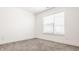 Bright bedroom with neutral carpet, a window, white walls and ample natural light at 1811 Livery Way, Indianapolis, IN 46202
