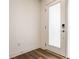 Bright entryway featuring wood-look flooring and white door at 1811 Livery Way, Indianapolis, IN 46202