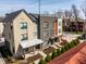 View of townhomes with modern architectural design, siding, and brick exterior at 1811 Livery Way, Indianapolis, IN 46202