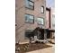 Modern brick condo with front door entry featuring dark trim and landscaping at 1811 Livery Way, Indianapolis, IN 46202