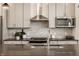 Modern kitchen featuring stainless appliances, backsplash, and barstool seating at 1811 Livery Way, Indianapolis, IN 46202