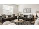 Comfortable living room features two sofas, stylish pillows, and a patterned rug at 1811 Livery Way, Indianapolis, IN 46202
