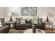 Living room with neutral decor, comfortable seating, and modern artwork at 1811 Livery Way, Indianapolis, IN 46202