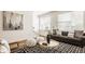 Bright living room with large windows, comfortable seating, and stylish decor at 1811 Livery Way, Indianapolis, IN 46202
