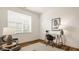Bright home office featuring a modern desk, minimalist decor, and comfortable seating for a productive workspace at 1811 Livery Way, Indianapolis, IN 46202