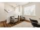 Cozy sitting area with natural light, comfortable chairs, and neutral tones for a relaxing space at 1811 Livery Way, Indianapolis, IN 46202