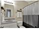 This bathroom features a single sink vanity and shower with curtain at 1896 Woodland Parks Dr, Columbus, IN 47201