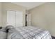 This bedroom has a double door closet and neutral walls at 1896 Woodland Parks Dr, Columbus, IN 47201