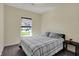 This bedroom has a window with blinds and neutral walls at 1896 Woodland Parks Dr, Columbus, IN 47201