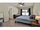 Bedroom featuring a ceiling fan, natural light, and wood dresser at 1896 Woodland Parks Dr, Columbus, IN 47201