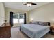 Bedroom featuring a ceiling fan, natural light, and wood dresser at 1896 Woodland Parks Dr, Columbus, IN 47201