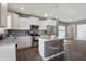 Bright kitchen featuring white cabinets, stainless steel appliances, and a center island with seating at 1896 Woodland Parks Dr, Columbus, IN 47201