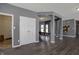 Open-concept space with storage closet, open floorplan, and visible dining area at 1896 Woodland Parks Dr, Columbus, IN 47201