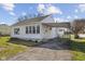 Charming single story home featuring vinyl siding, attached carport, and a neatly kept lawn at 2501 Reformers Ave, Indianapolis, IN 46203