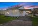 Charming single story home featuring vinyl siding, attached carport, and a neatly kept lawn at 2501 Reformers Ave, Indianapolis, IN 46203