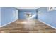Spacious living room area with light wood flooring and blue painted walls at 2501 Reformers Ave, Indianapolis, IN 46203