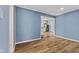 Spacious living room area with light wood flooring and blue painted walls at 2501 Reformers Ave, Indianapolis, IN 46203