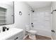 Updated bathroom featuring modern fixtures, a white shower-tub, and stylish vanity at 3153 Stillmeadow Dr, Indianapolis, IN 46214