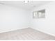 A cozy bedroom with gray carpet and walls, featuring a window with blinds for natural light at 3153 Stillmeadow Dr, Indianapolis, IN 46214