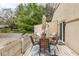 Outdoor deck with table and chairs offers a relaxing space with a view of the surroundings, near sliding glass doors at 3153 Stillmeadow Dr, Indianapolis, IN 46214