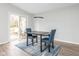 Bright dining area features sliding glass doors and a modern light fixture above a stylish table at 3153 Stillmeadow Dr, Indianapolis, IN 46214