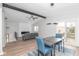 Bright open floor plan highlighting a dining area with sleek decor and LVP flooring at 3153 Stillmeadow Dr, Indianapolis, IN 46214