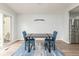 Modern dining area showcasing stylish chairs, an elegant light fixture, and LVP flooring at 3153 Stillmeadow Dr, Indianapolis, IN 46214