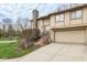 Exterior facade showing the front door, attached garage, front yard and stone chimney at 3153 Stillmeadow Dr, Indianapolis, IN 46214