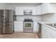 Modern kitchen with stainless steel appliances, white cabinetry, and sleek countertops at 3153 Stillmeadow Dr, Indianapolis, IN 46214