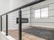 Bright living space showcasing a modern fireplace, luxury vinyl flooring, and a large window at 3153 Stillmeadow Dr, Indianapolis, IN 46214