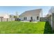 The spacious backyard offers a lush lawn and patio, perfect for entertaining and outdoor activities at 329 Dogwood Dr, Pendleton, IN 46064