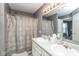 Spacious bathroom features a double vanity, large mirror, and shower-tub combination at 329 Dogwood Dr, Pendleton, IN 46064