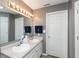 Bright bathroom with double sinks, a large mirror, and updated fixtures at 329 Dogwood Dr, Pendleton, IN 46064