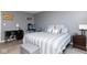 Comfortable bedroom featuring gray walls, a queen bed, and a workspace area at 329 Dogwood Dr, Pendleton, IN 46064