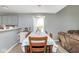 Dining area with seating, featuring natural light and an open layout to the living room at 329 Dogwood Dr, Pendleton, IN 46064
