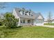 Well-maintained two-story home with a welcoming front porch and neat landscaping at 329 Dogwood Dr, Pendleton, IN 46064
