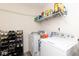 Functional laundry room equipped with modern washer, dryer, and convenient storage at 329 Dogwood Dr, Pendleton, IN 46064