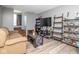 Spacious living room with comfortable seating, entertainment center, and shelving units filled with collectibles at 329 Dogwood Dr, Pendleton, IN 46064