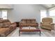 Cozy living room with comfortable seating, featuring new floors and natural light at 329 Dogwood Dr, Pendleton, IN 46064