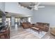 Spacious living room with vaulted ceilings, modern flooring, and an open layout to the kitchen at 329 Dogwood Dr, Pendleton, IN 46064