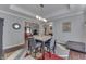 Bright dining area featuring stylish gray walls, modern lighting, and seamless access to other living areas at 34 David Ln, Indianapolis, IN 46227